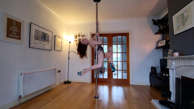 arlene caffrey is demonstrating beginner spinny pole choreography for october 2022